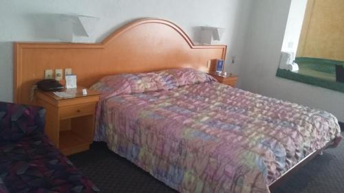 Ένα ή περισσότερα κρεβάτια σε δωμάτιο στο Hotel Inn Sur