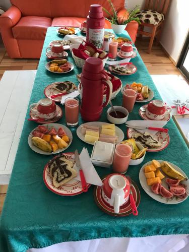 a table filled with plates of food on a table at HARÉ MANU Rapa Nui in Hanga Roa