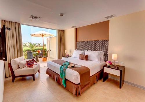 Ένα ή περισσότερα κρεβάτια σε δωμάτιο στο VPX Hotel