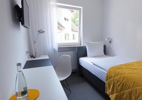 Cama o camas de una habitación en Der Grüne Baum