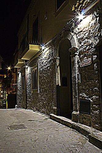 a stone building with lights on it at night at Bed & Breakfast Via Venezia in Regalbuto