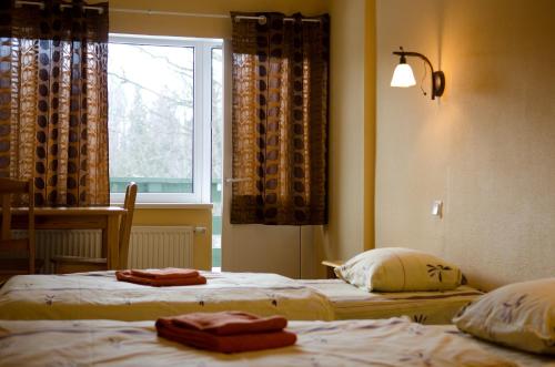 Ένα ή περισσότερα κρεβάτια σε δωμάτιο στο Nelijärve Holiday Centre