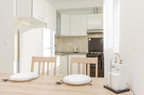Kuchyň nebo kuchyňský kout v ubytování Apartments New home