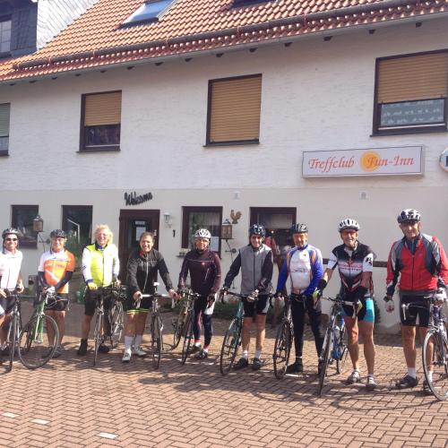a group of people on bikes in front of a building at fun4all-holidayhome in Medebach