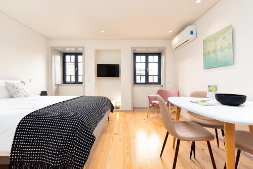 Postel nebo postele na pokoji v ubytování Bom Jardim Apartments