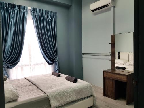 a bedroom with a bed and a mirror and a window at SS Homestay Borneo Housing SL3A in Kuching