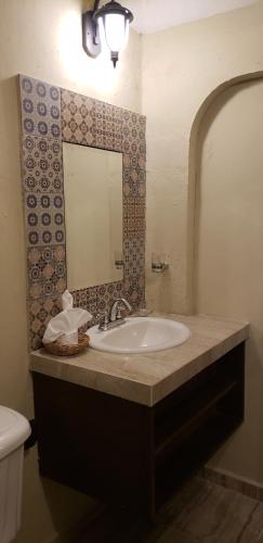 Ein Badezimmer in der Unterkunft Hotel Peregrina