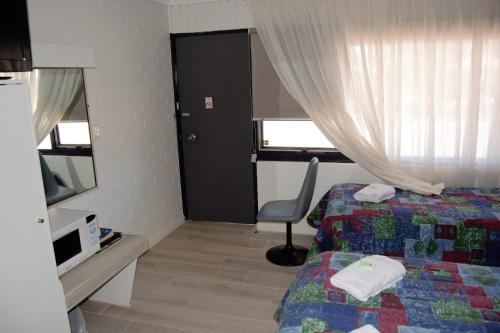 Ένα ή περισσότερα κρεβάτια σε δωμάτιο στο Civic Motor Inn