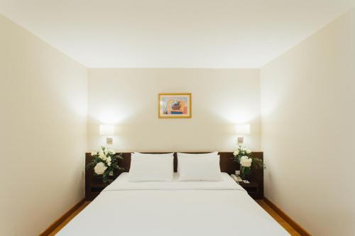 Posteľ alebo postele v izbe v ubytovaní Seasons Siam Hotel