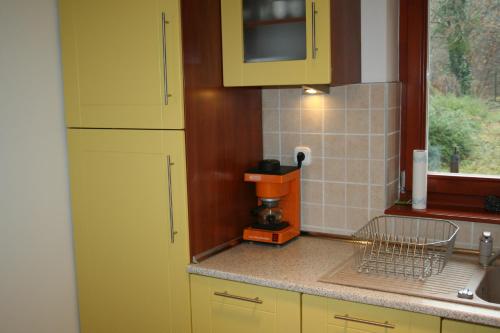 A kitchen or kitchenette at Treasure Deluxe House