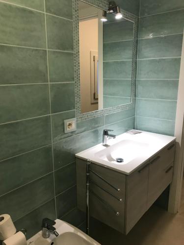 a bathroom with a sink and a mirror at APPARTAMENTI del DUCA in Ferrara