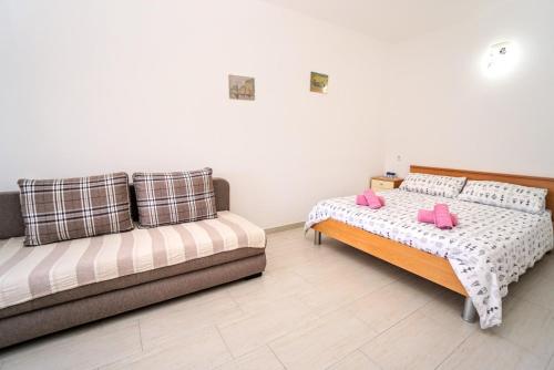 Кровать или кровати в номере Apartment Mirela