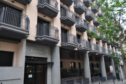 a building with balconies on the side of it at Apartaments AR Trimar in Lloret de Mar