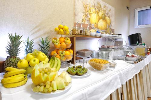 a buffet with fruits and vegetables on a table at LH Hotel Lloyd Roma in Rome