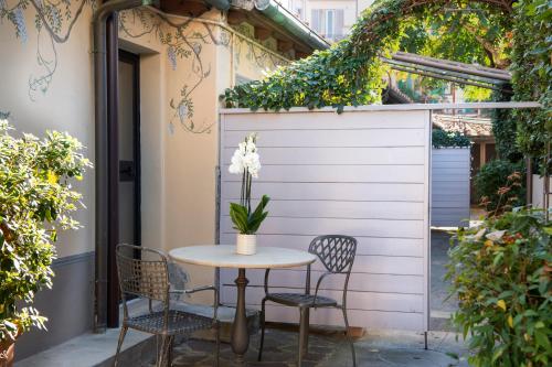 a table and chairs sitting on a patio at Hotel Grifone Firenze - Meetings & Spa in Florence