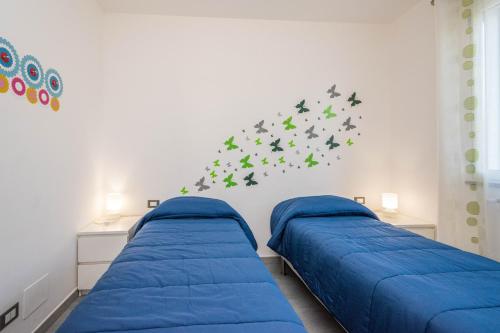 Un pat sau paturi într-o cameră la Villa Francesco...graziosa, moderna, confortevole!