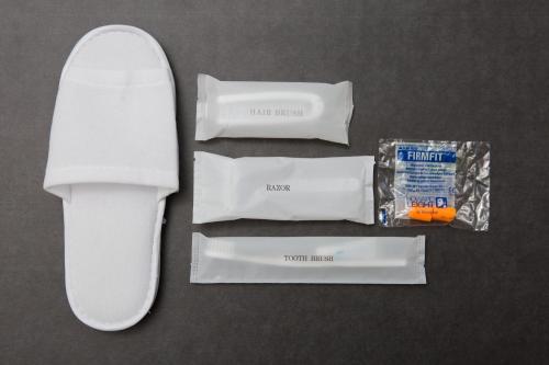 a pair of whiteasters and a bag of tooth paste at TSUKIMI HOTEL in Kyoto