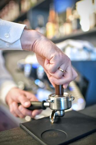 a person with their hand on a barber practition at Lubhotel in Lublin