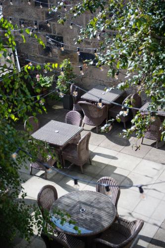 an overhead view of a patio with tables and chairs at One Devonshire Gardens a Hotel Du Vin in Glasgow