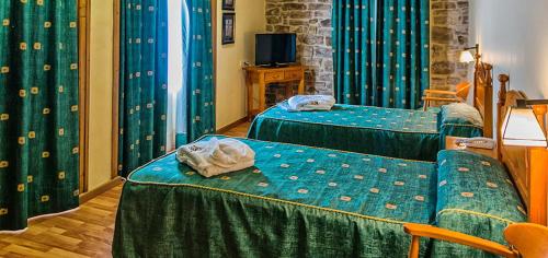 En eller flere senger på et rom på Hotel Balneari de Vallfogona de Riucorb