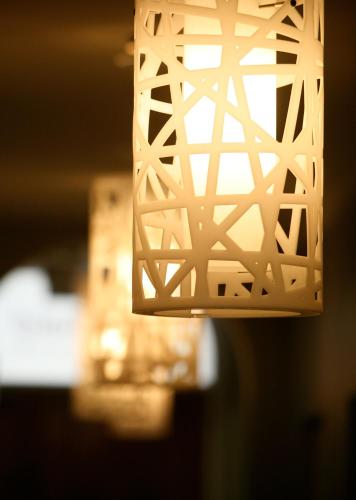 a light fixture hanging from a ceiling at Adabco Boutique Hotel Adelaide in Adelaide