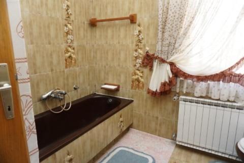 a bathroom with a black sink and a window at Mariella in Bašanija