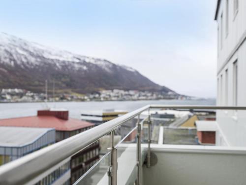a balcony of a ship with a snowy mountain in the background at Radisson Blu Hotel Tromsø in Tromsø