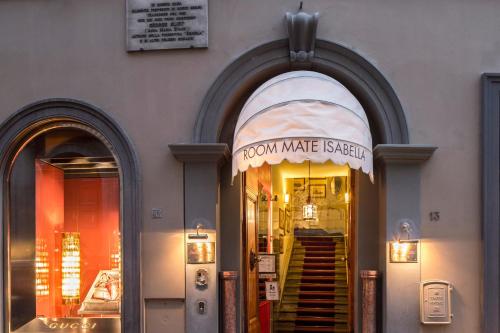 a store front with a sign that reads room make sister at Room Mate Collection Isabella, Florence in Florence