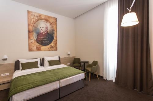 Säng eller sängar i ett rum på Hotel Grand Hedonist