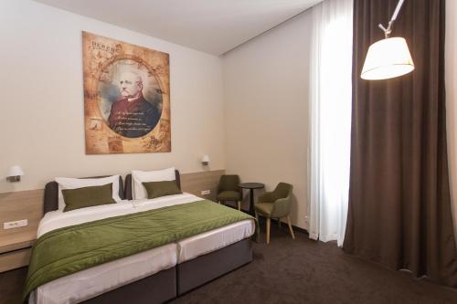 Postel nebo postele na pokoji v ubytování Hotel Grand Hedonist