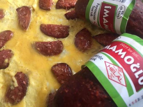 a close up of a slice of pizza with pepperoni at Imamoglu Pasa Butik Hotel in Kayseri