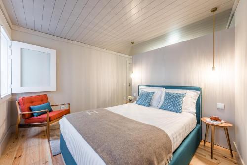Ένα ή περισσότερα κρεβάτια σε δωμάτιο στο Casa da Cera da Porta da Vila