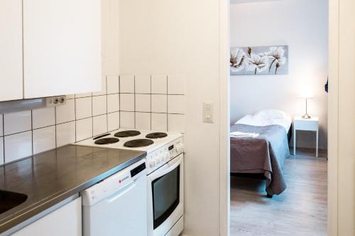 Η κουζίνα ή μικρή κουζίνα στο Apartamentos Joensuu - Kauppakatu 7