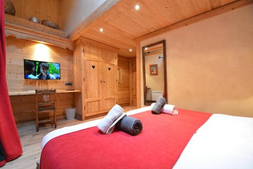 Ένα ή περισσότερα κρεβάτια σε δωμάτιο στο Chalet les trois coeurs