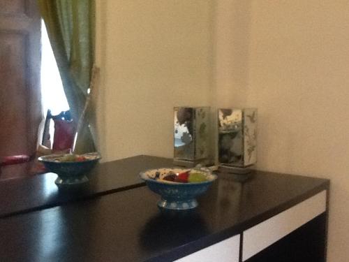 a black counter with two bowls of fruit on it at Regent Serviced Suites in Doncaster