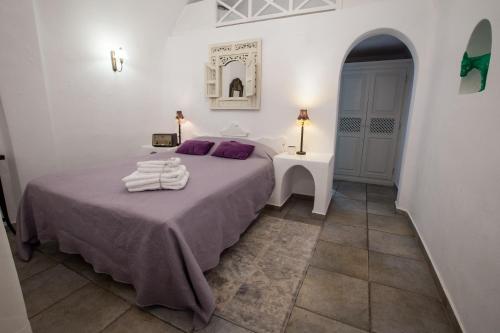 Afroessa Hotel by Pearl Hotel Collectionにあるベッド
