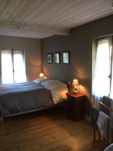 Postel nebo postele na pokoji v ubytování La Ferme Des Vignes