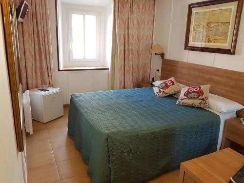 Ένα ή περισσότερα κρεβάτια σε δωμάτιο στο Hotel La Residencia