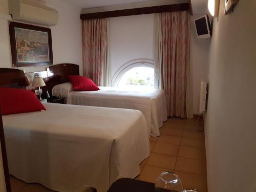 Ένα ή περισσότερα κρεβάτια σε δωμάτιο στο Hotel La Residencia