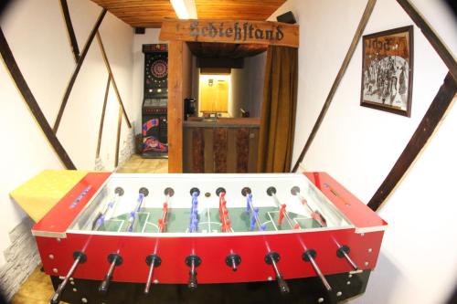 a wooden chest with a pool of water in a room at Alpen Wohlfühlhotel Dörflwirt in Hainzenberg