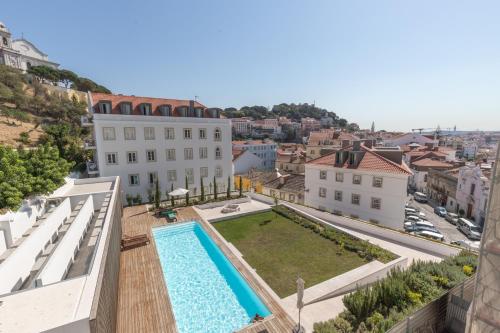 an apartment with a swimming pool on the roof of a building at Prime Lisbon - Mouraria in Lisbon