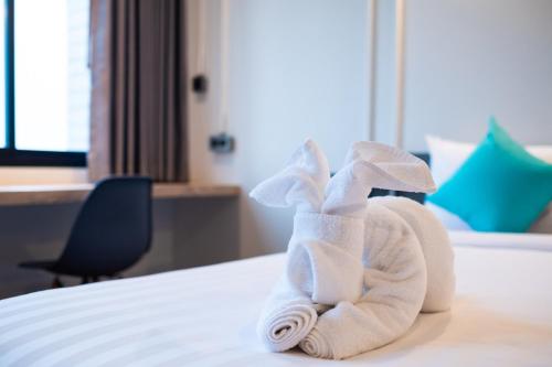 Postel nebo postele na pokoji v ubytování S.22 Hotel Suratthani
