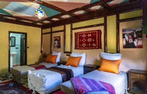 A bed or beds in a room at Riad Atlas Panorama