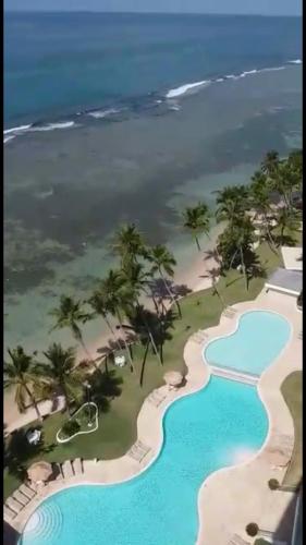 an aerial view of the pool at the resort at Beachfront, Juandolio in Juan Dolio