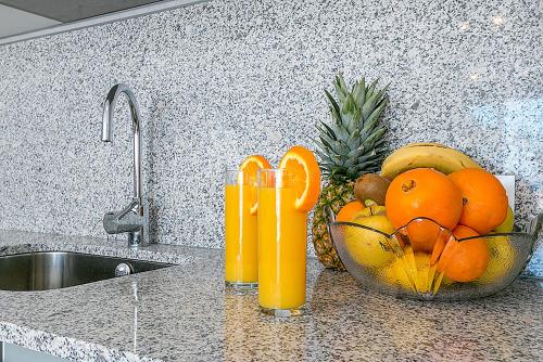 a bowl of oranges and a bowl of fruit on a kitchen counter at Apartment CB 2 in Alcudia