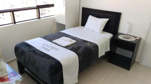 Postel nebo postele na pokoji v ubytování Hotel Murano