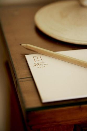 a table with a napkin and plates on it at Hotel & Residenza 100 Torri in Ascoli Piceno