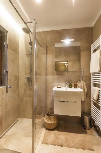 a bathroom with a sink and a shower at Prague Expat House in Prague