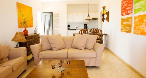 a living room with a couch and a coffee table at Apartamentos Parque Mar in Cala d´Or