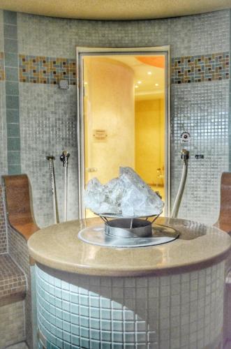 a bathroom with a round counter with a sink at Bellevue Residence Apartments in Bansko